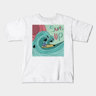 Skull on a surf board riding a wave Kids T-Shirt